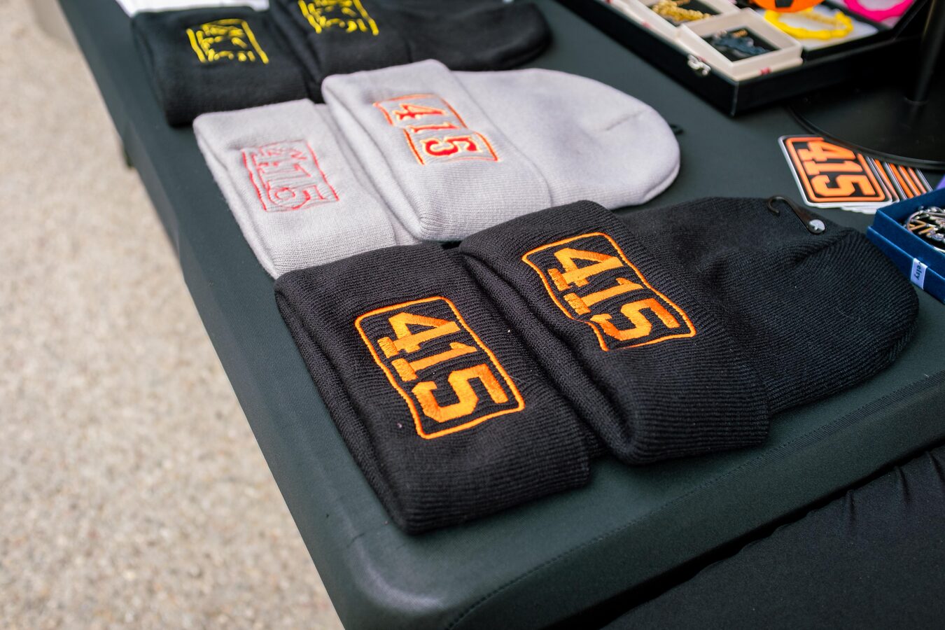 Locally made knit hats displayed by a vendor